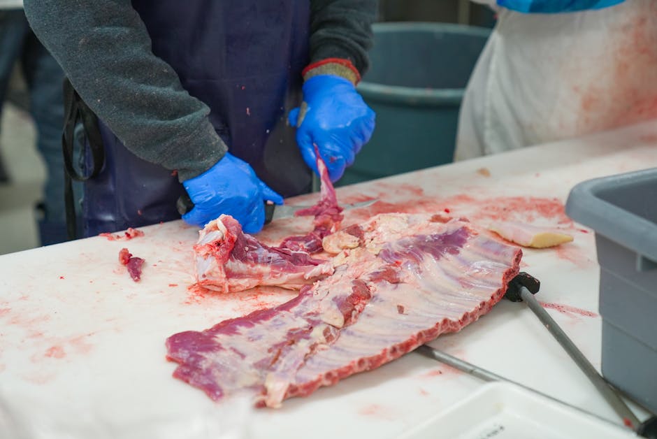 Professional chef using quality knife set in commercial kitchen environment