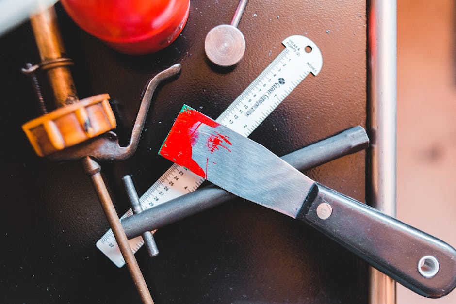 Knife crafting workshop with professional tools and workspace setup