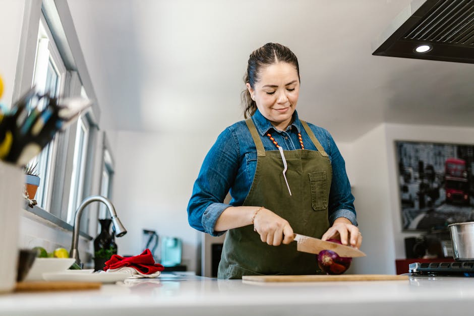 Happy person cooking at home with quality kitchen knives