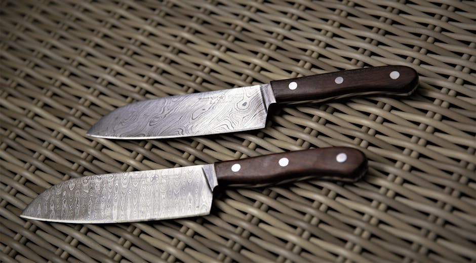 Damascus steel knife blade with distinctive wavy pattern showing expert craftsmanship