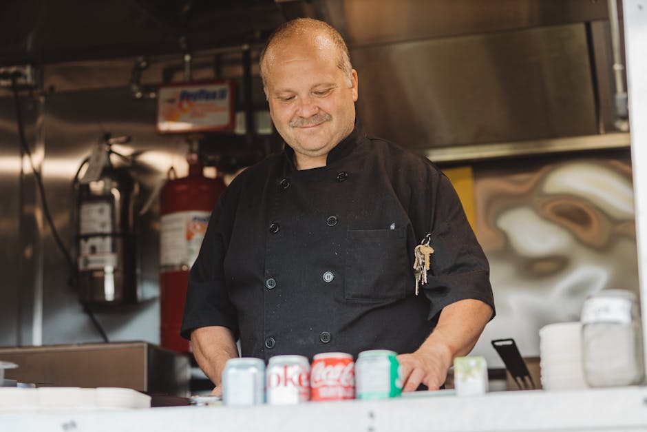 Smiling professional chef satisfied with quality kitchen tools